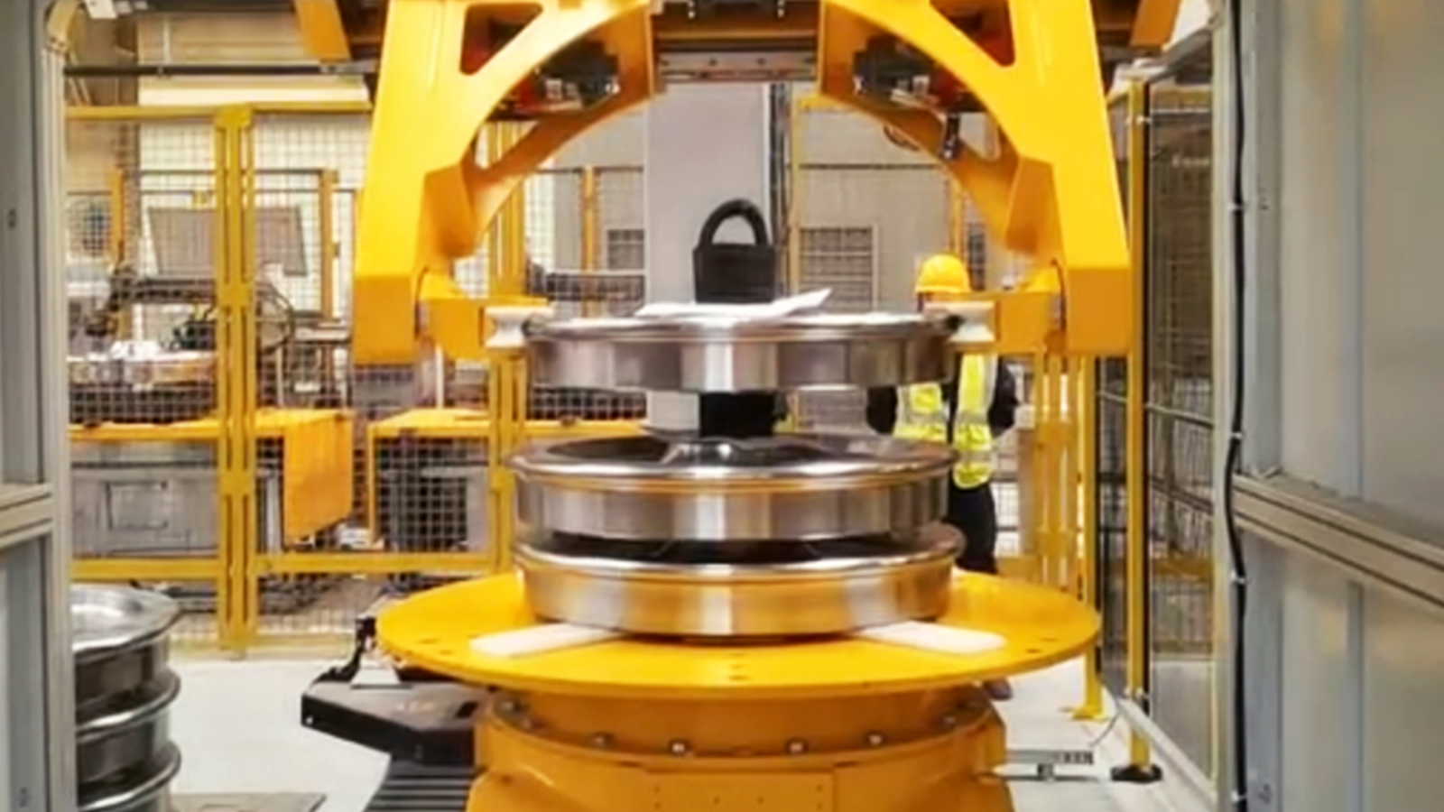 Vision-Guided Loading and Unloading of Wheel Hubs